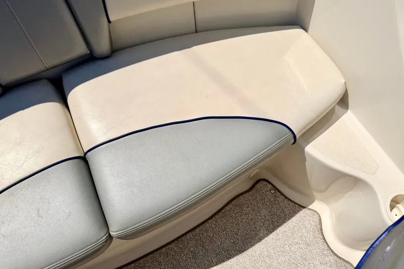 Slide: The Image of 2008 Sea Ray 195 Sport boat interior seating with gray and white upholstery. - 35