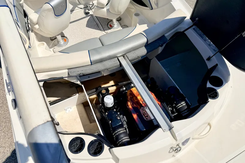 Slide: The Image of 2008 Sea Ray 195 Sport boat interior with open engine compartment and seating area. - 29