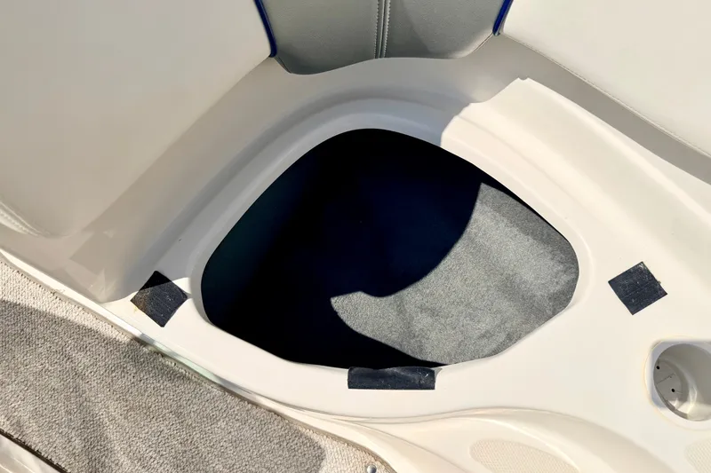 Slide: The Image of Storage compartment in a 2008 Sea Ray 195 Sport boat interior. - 63