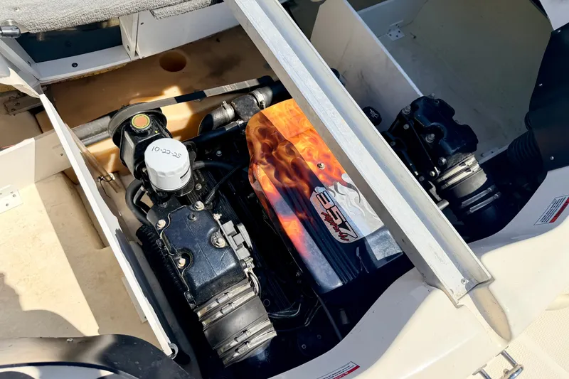 Slide: The Image of Engine compartment of a 2008 Sea Ray 195 Sport boat, showcasing detailed components. - 27