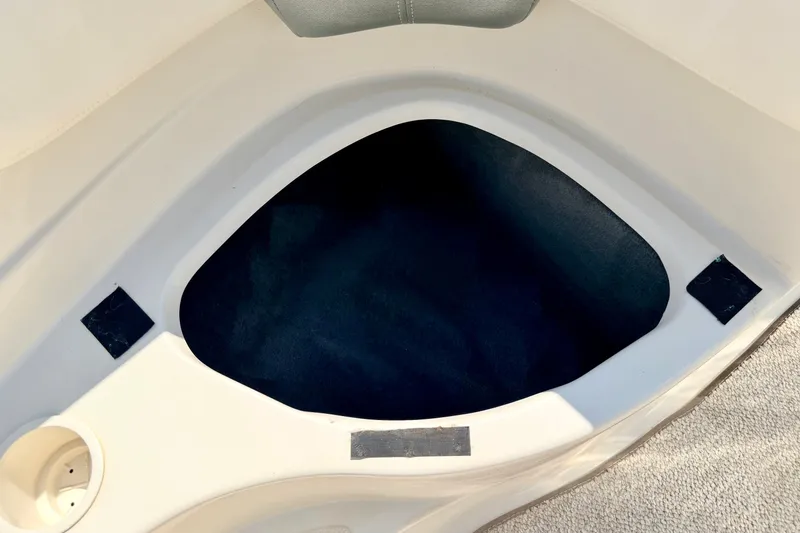 Slide: The Image of Storage compartment in a 2008 Sea Ray 195 Sport boat, featuring a clean interior design. - 61