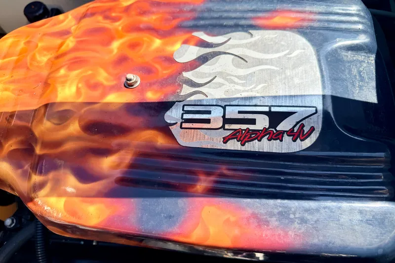 Slide: The Image of Engine cover with flame design and "357 Alpha 4V" text on a 2008 Sea Ray 195 Sport. - 28