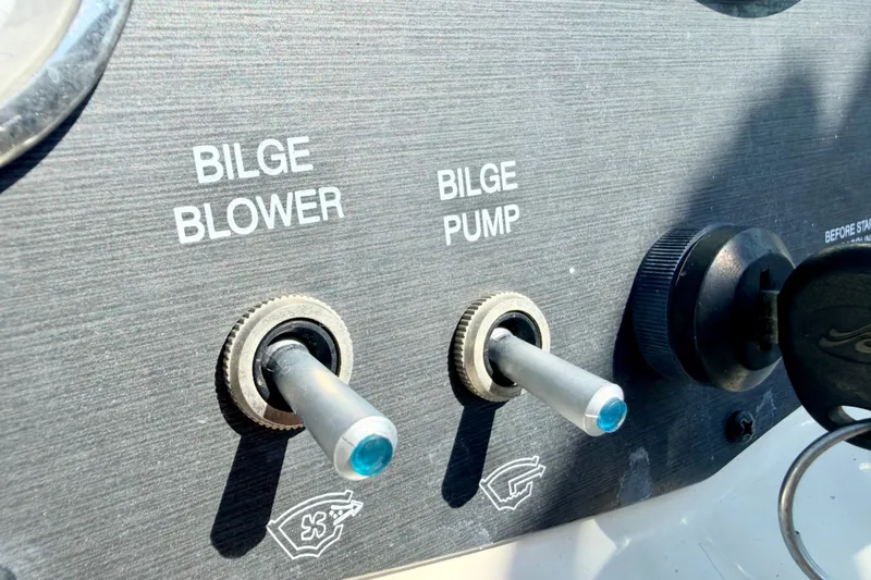 Slide: The Image of Control panel of a 2008 Sea Ray 195 Sport boat with bilge blower and pump switches. - 44