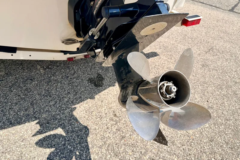 Slide: The Image of Propeller of a 2008 Sea Ray 195 Sport boat on asphalt surface. - 17