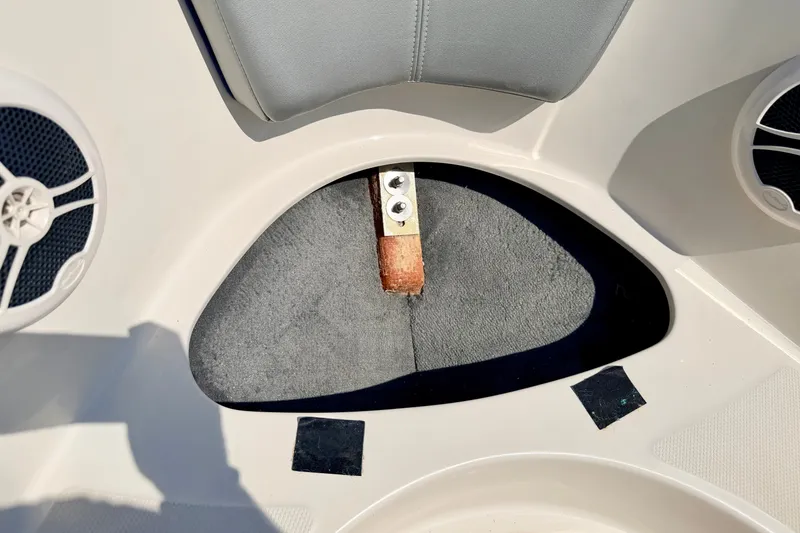 Slide: The Image of Interior view of a 2008 Sea Ray 195 Sport boat, featuring seating and speaker details. - 57