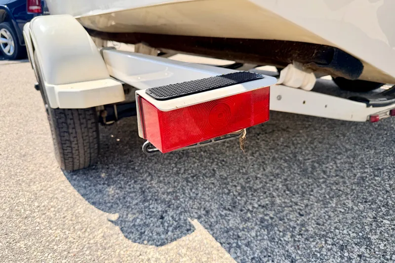 Slide: The Image of Trailer light on a 2008 Sea Ray 195 Sport boat trailer, parked on asphalt. - 74