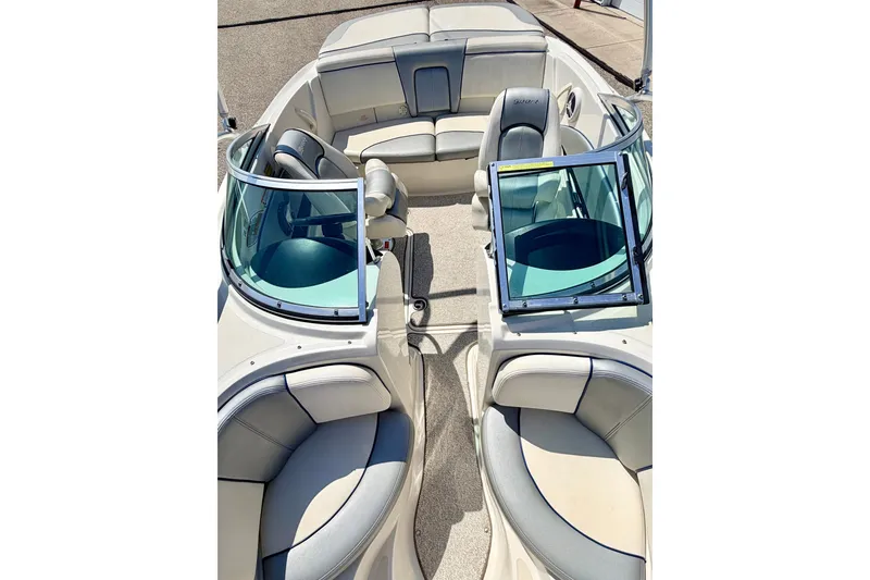 Slide: The Image of 2008 Sea Ray 195 Sport boat interior with cushioned seating and windshield. - 68