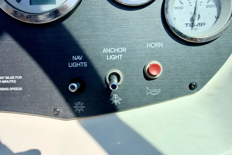 Slide: The Image of Dashboard controls of a 2008 Sea Ray 195 Sport boat, featuring navigation lights and horn. - 45