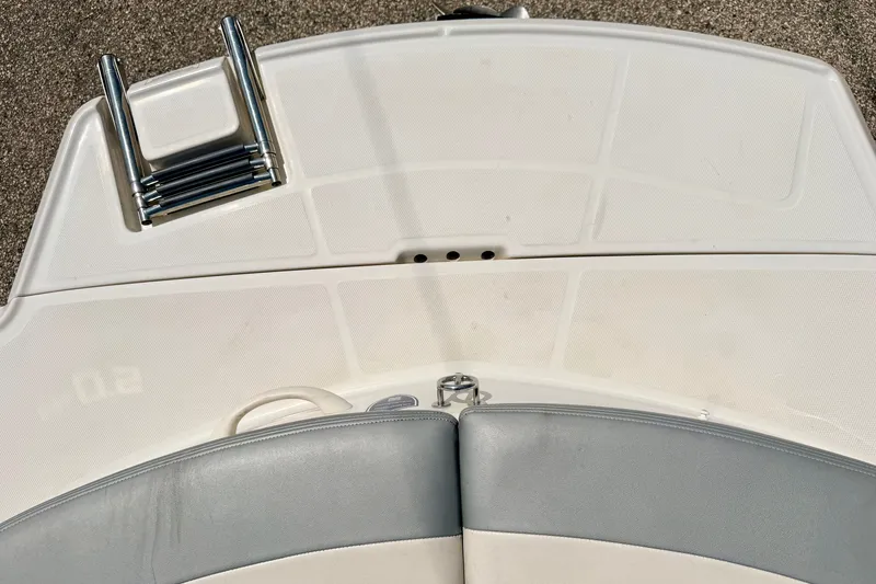 Slide: The Image of 2008 Sea Ray 195 Sport boat deck with folded ladder and cushioned seating. - 26