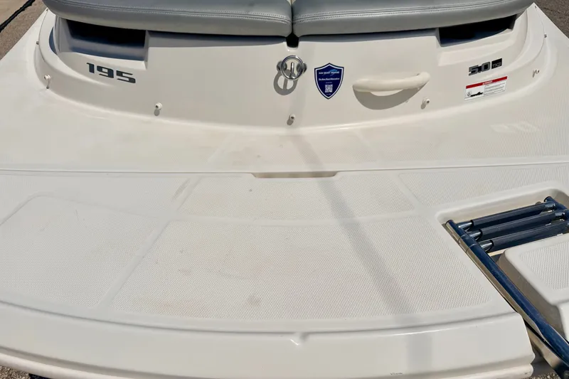 Slide: The Image of 2008 Sea Ray 195 Sport boat deck with seating and ladder. - 23