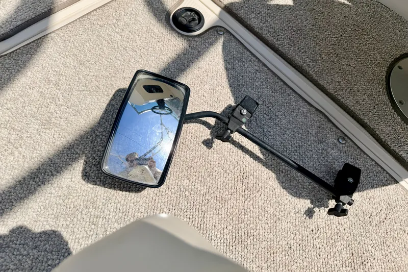 Slide: The Image of Rearview mirror on carpeted floor of a 2008 Sea Ray 195 Sport boat. - 54