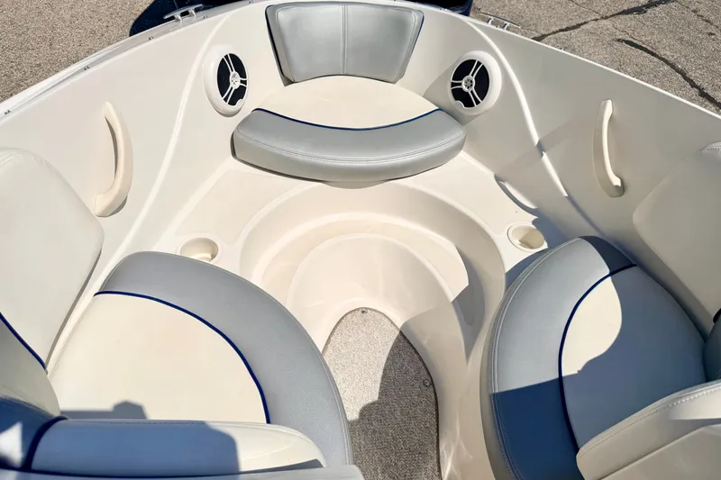 Slide: The Image of Interior seating of a 2008 Sea Ray 195 Sport boat, featuring gray and white upholstery. - 55