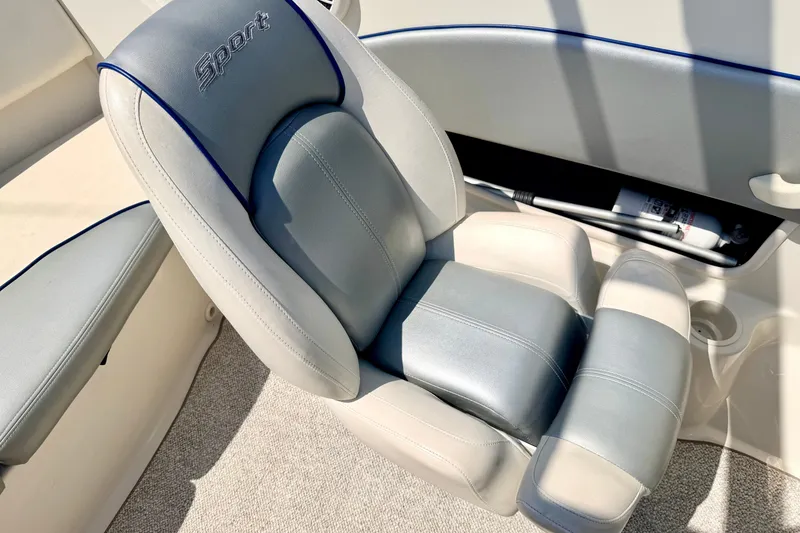 Slide: The Image of 2008 Sea Ray 195 Sport boat seat with gray upholstery and "Sport" embroidery. - 49