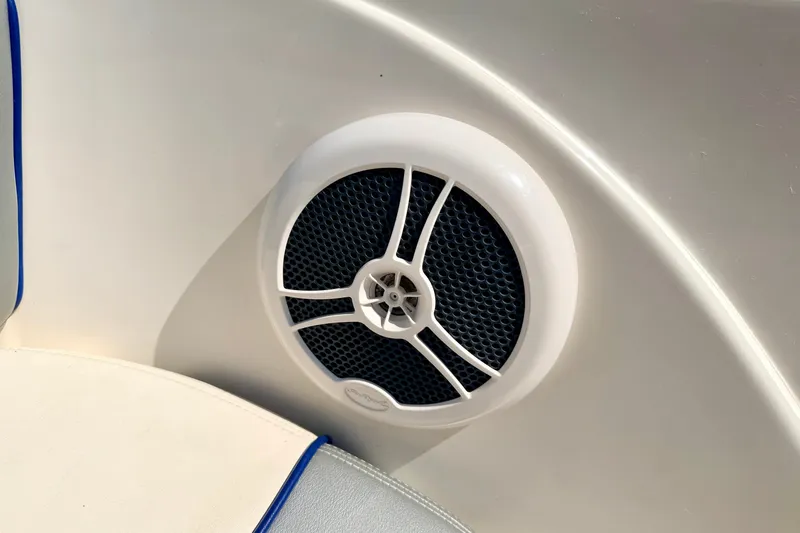 Slide: The Image of Speaker on a 2008 Sea Ray 195 Sport boat interior, featuring white and blue accents. - 58