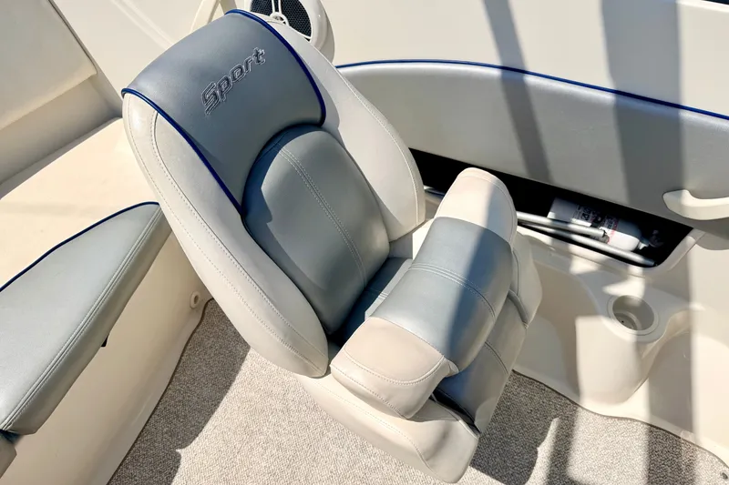 Slide: The Image of 2008 Sea Ray 195 Sport boat seat with gray and white upholstery. - 50