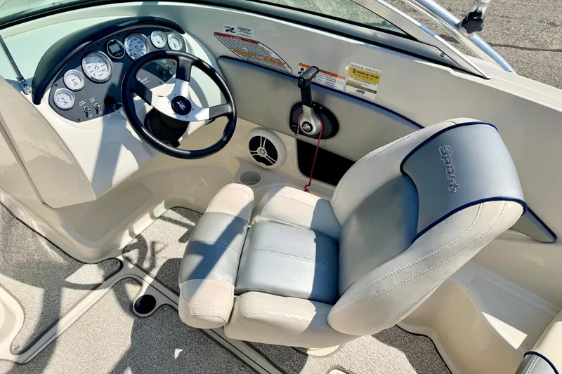 Slide: The Image of 2008 Sea Ray 195 Sport boat interior with steering wheel and gauges. - 37