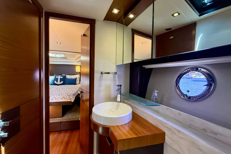 Slide: The Image of Luxurious interior of 2015 Tiara Yachts 50 Coupe, featuring elegant bathroom and cozy bedroom. - 66