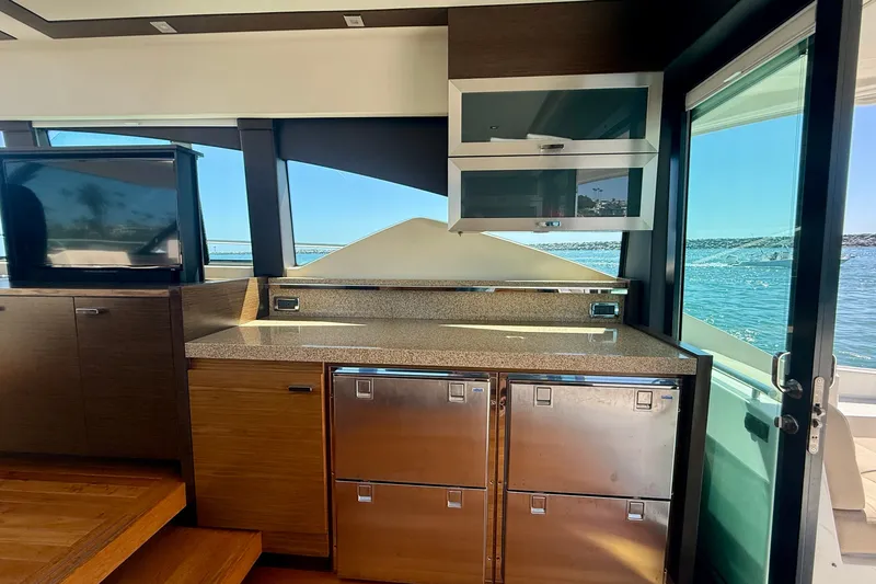 Slide: The Image of Interior of 2015 Tiara Yachts 50 Coupe with modern kitchen and ocean view. - 31