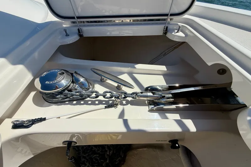 Slide: The Image of Anchor compartment of 2015 Tiara Yachts 50 Coupe with chain and windlass. - 83