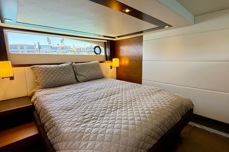 Slide: The Image of Luxurious bedroom interior of 2015 Tiara Yachts 50 Coupe with elegant bedding and modern lighting. - 47
