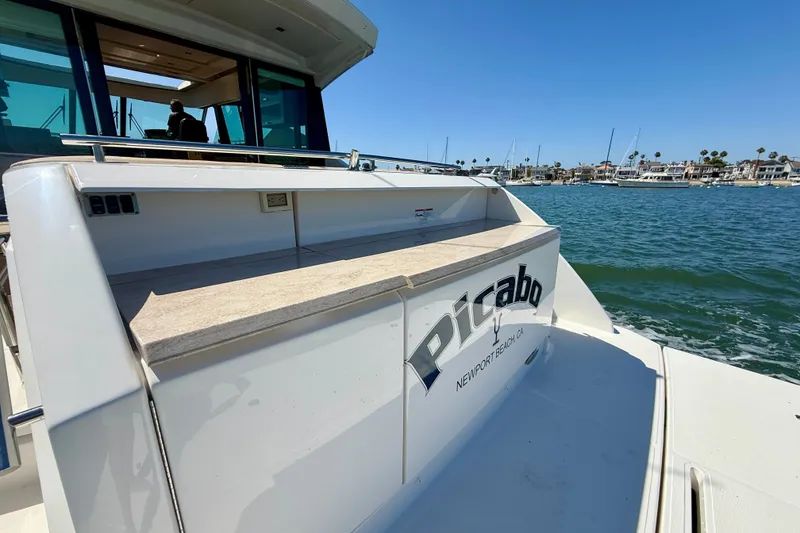 Slide: The Image of 2015 Tiara Yachts 50 Coupe on water, Newport Beach, sunny day. - 91