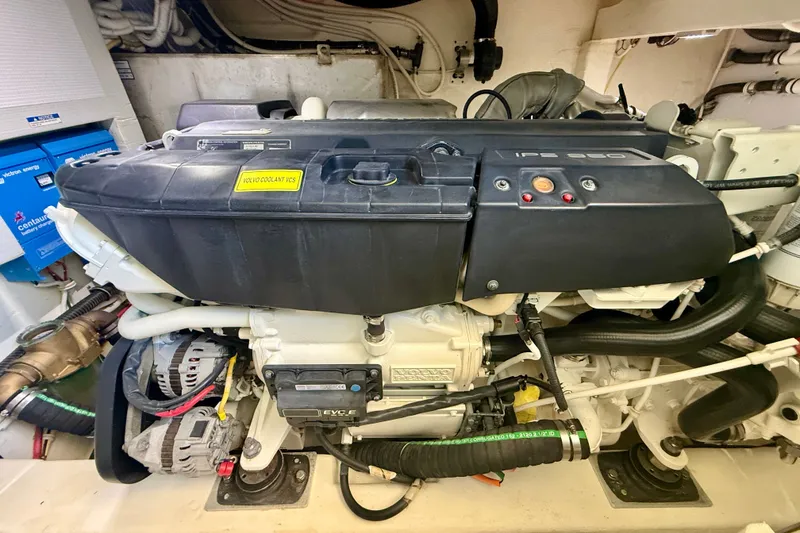 Slide: The Image of Engine room of a 2015 Tiara Yachts 50 Coupe, featuring a Volvo IPS 950 engine. - 98