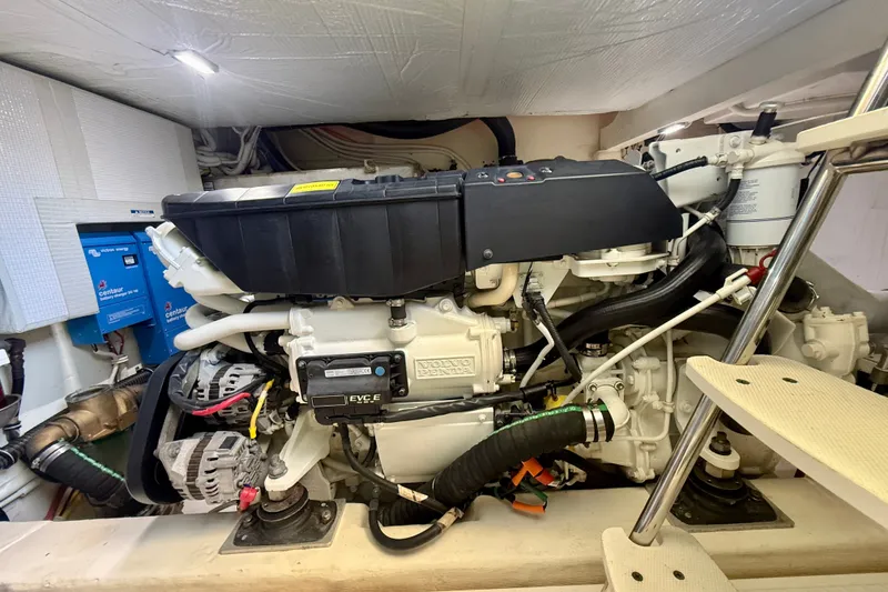 Slide: The Image of Engine room of a 2015 Tiara Yachts 50 Coupe, featuring a Volvo Penta engine. - 100