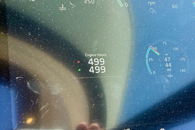 Slide: The Image of Dashboard of 2015 Tiara Yachts 50 Coupe showing 499 engine hours. - 97