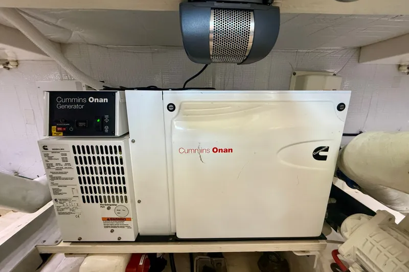 Slide: The Image of Cummins Onan generator in 2015 Tiara Yachts 50 Coupe engine room. - 94