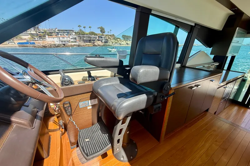 Slide: The Image of Interior of 2015 Tiara Yachts 50 Coupe with captain's chair and helm. - 42