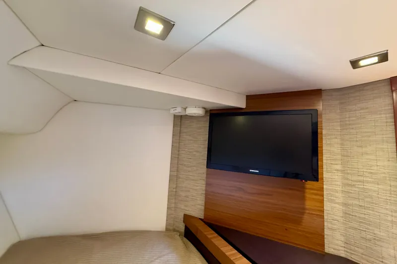Slide: The Image of Interior cabin of 2015 Tiara Yachts 50 Coupe with wall-mounted TV and modern lighting. - 71