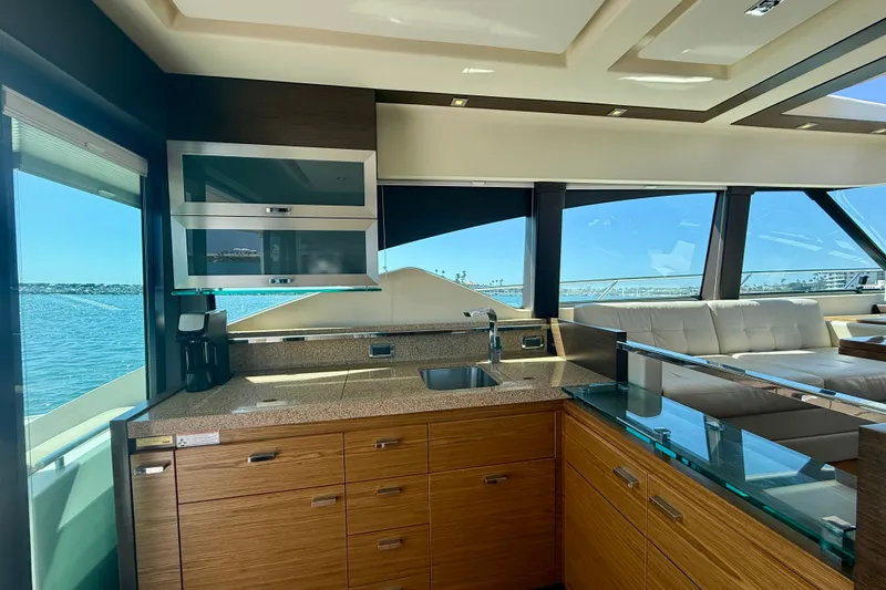 Slide: The Image of Luxurious interior of 2015 Tiara Yachts 50 Coupe with modern kitchen and ocean view. - 27