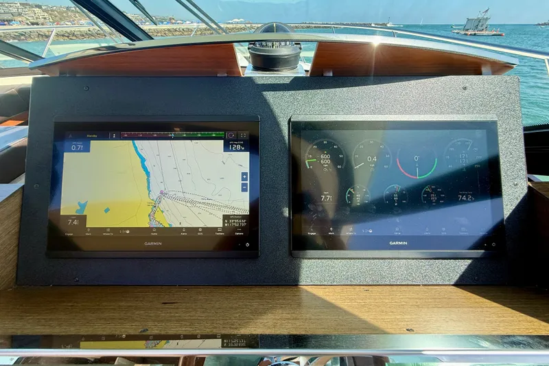 Slide: The Image of Cockpit of 2015 Tiara Yachts 50 Coupe with Garmin navigation displays. - 40