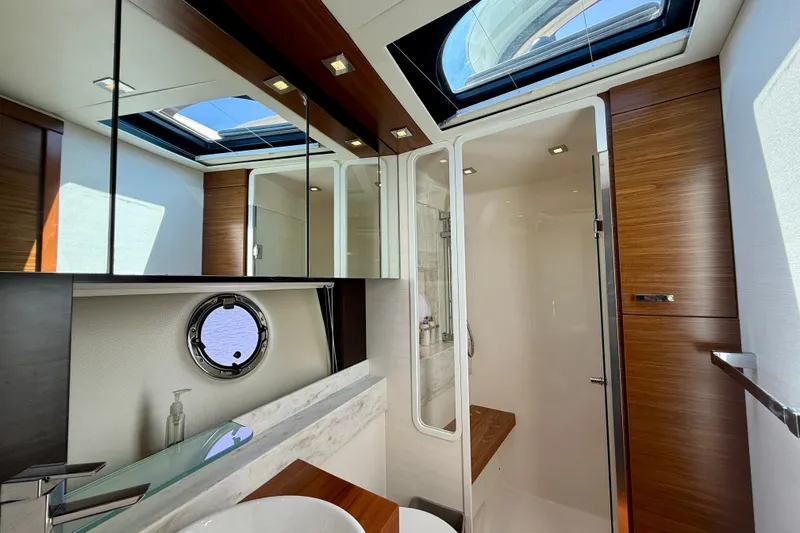 Slide: The Image of Luxurious bathroom interior of 2015 Tiara Yachts 50 Coupe with skylight and modern fixtures. - 54