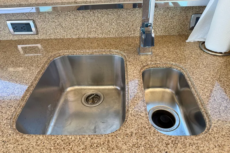 Slide: The Image of Dual stainless steel sinks on Tiara Yachts 50 Coupe 2015, granite countertop, modern faucet. - 34