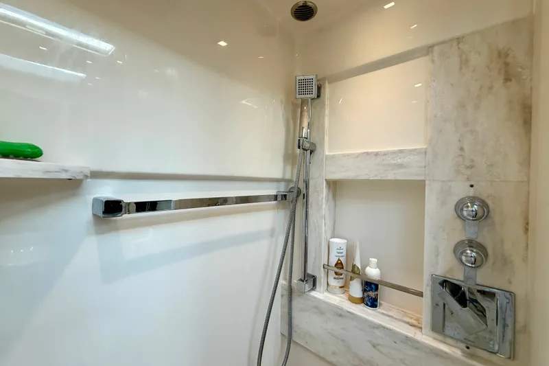 Slide: The Image of Luxurious shower area in 2015 Tiara Yachts 50 Coupe, featuring modern fixtures and amenities. - 69