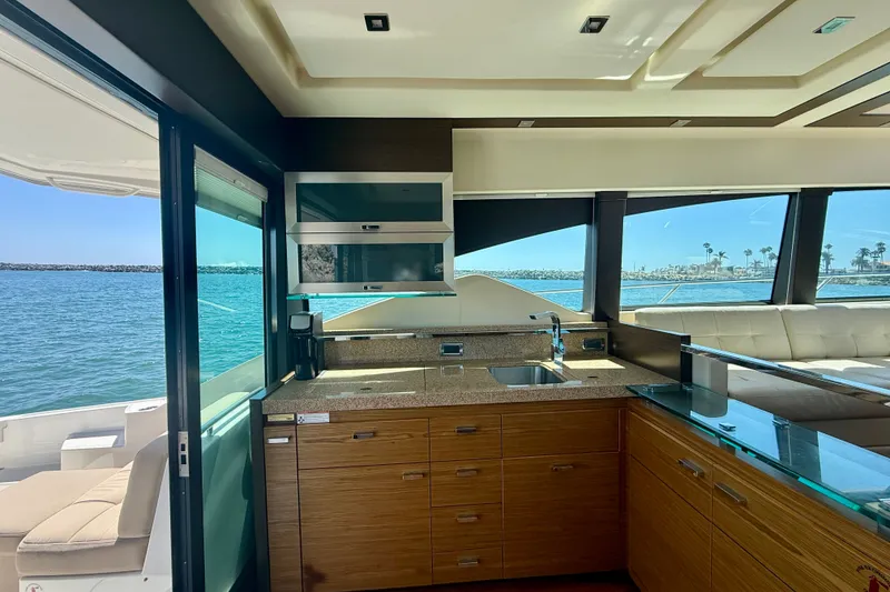Slide: The Image of Luxurious interior of 2015 Tiara Yachts 50 Coupe with modern kitchen and ocean view. - 20