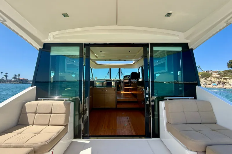 Slide: The Image of 2015 Tiara Yachts 50 Coupe interior with luxurious seating and ocean view. - 78