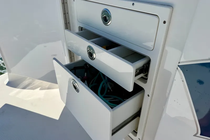 Slide: The Image of Storage drawers on a 2015 Tiara Yachts 50 Coupe, showcasing sleek design and functionality. - 86