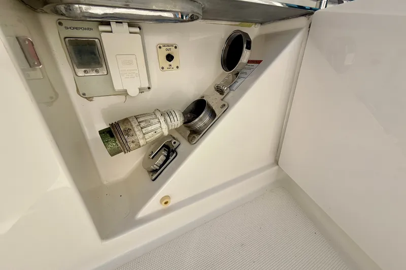 Slide: The Image of Shore power connection on a 2015 Tiara Yachts 50 Coupe boat. - 90