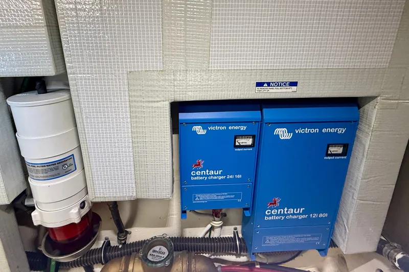 Slide: The Image of Engine room of 2015 Tiara Yachts 50 Coupe with Victron Energy battery chargers. - 101