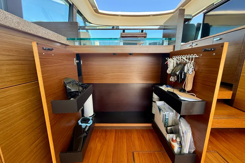 Slide: The Image of Interior storage of 2015 Tiara Yachts 50 Coupe with organized compartments and accessories. - 30