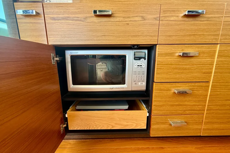 Slide: The Image of Built-in microwave in Tiara Yachts 50 Coupe 2015 kitchen cabinetry. - 29