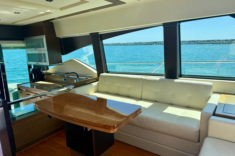 Slide: The Image of Luxurious interior of 2015 Tiara Yachts 50 Coupe with ocean view through large windows. - 15