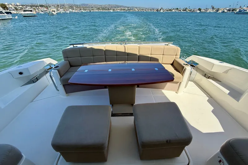 Slide: The Image of Luxurious 2015 Tiara Yachts 50 Coupe with elegant seating and scenic ocean view. - 74