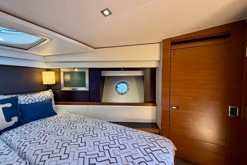 Slide: The Image of Luxurious bedroom interior of 2015 Tiara Yachts 50 Coupe with elegant wood finishes. - 64