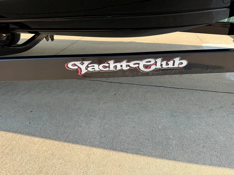 Slide: The Image of Close-up of a boat trailer with "Yacht Club" written in stylized lettering. - 30
