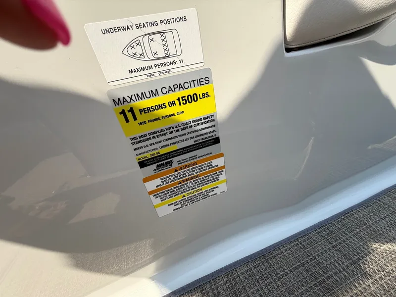 Slide: The Image of A sign on a boat shows the maximum capacity of 11 persons or 1500 pounds. - 18