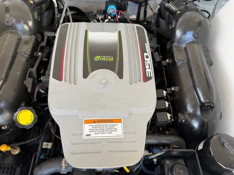 Slide: The Image of The engine compartment of a 2015 Crownline 235 SS features a MerCruiser 350 MAG engine. - 27
