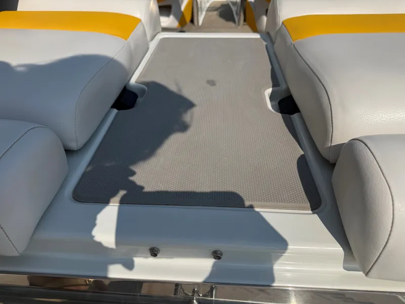 Slide: The Image of The image shows the cockpit of a Crownline 235 SS boat with white and yellow seats. - 11